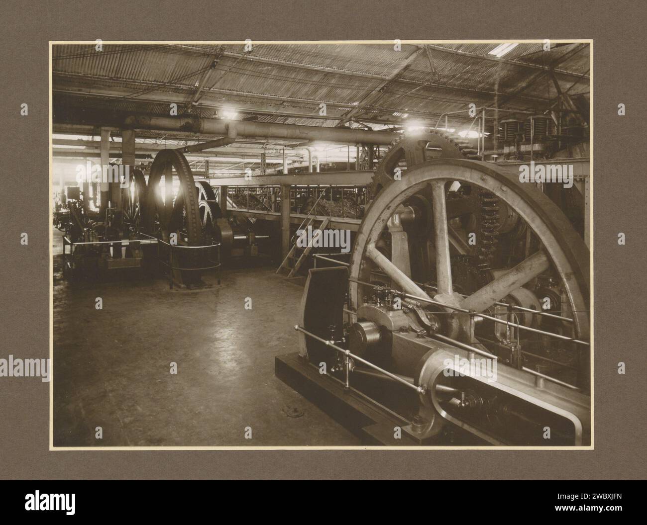 Machines in a hall of sugar factory Meritjan in Kediri on Java, c. 1925 ...