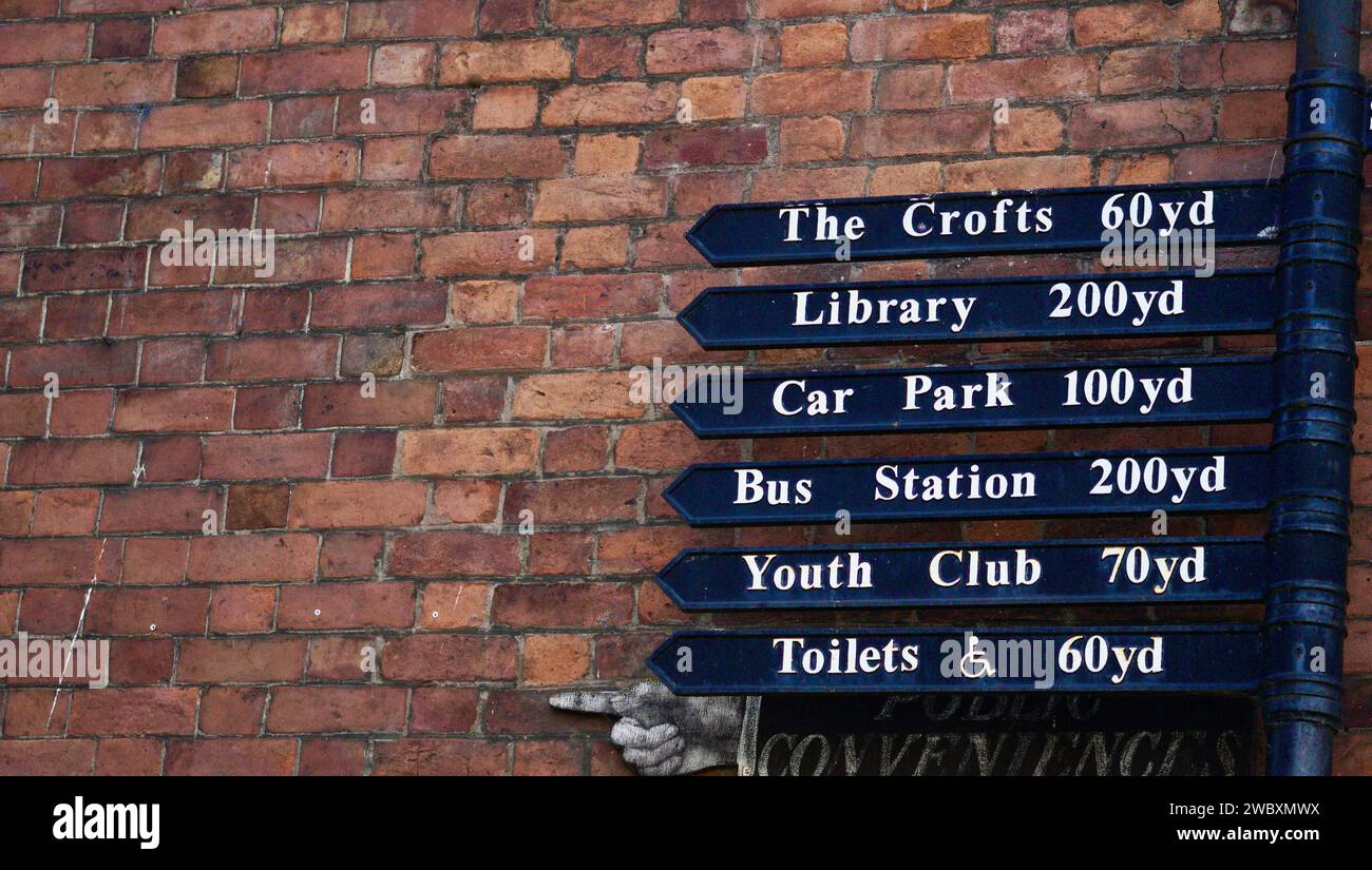 Directional information sign black arrowed signs pointing to popular