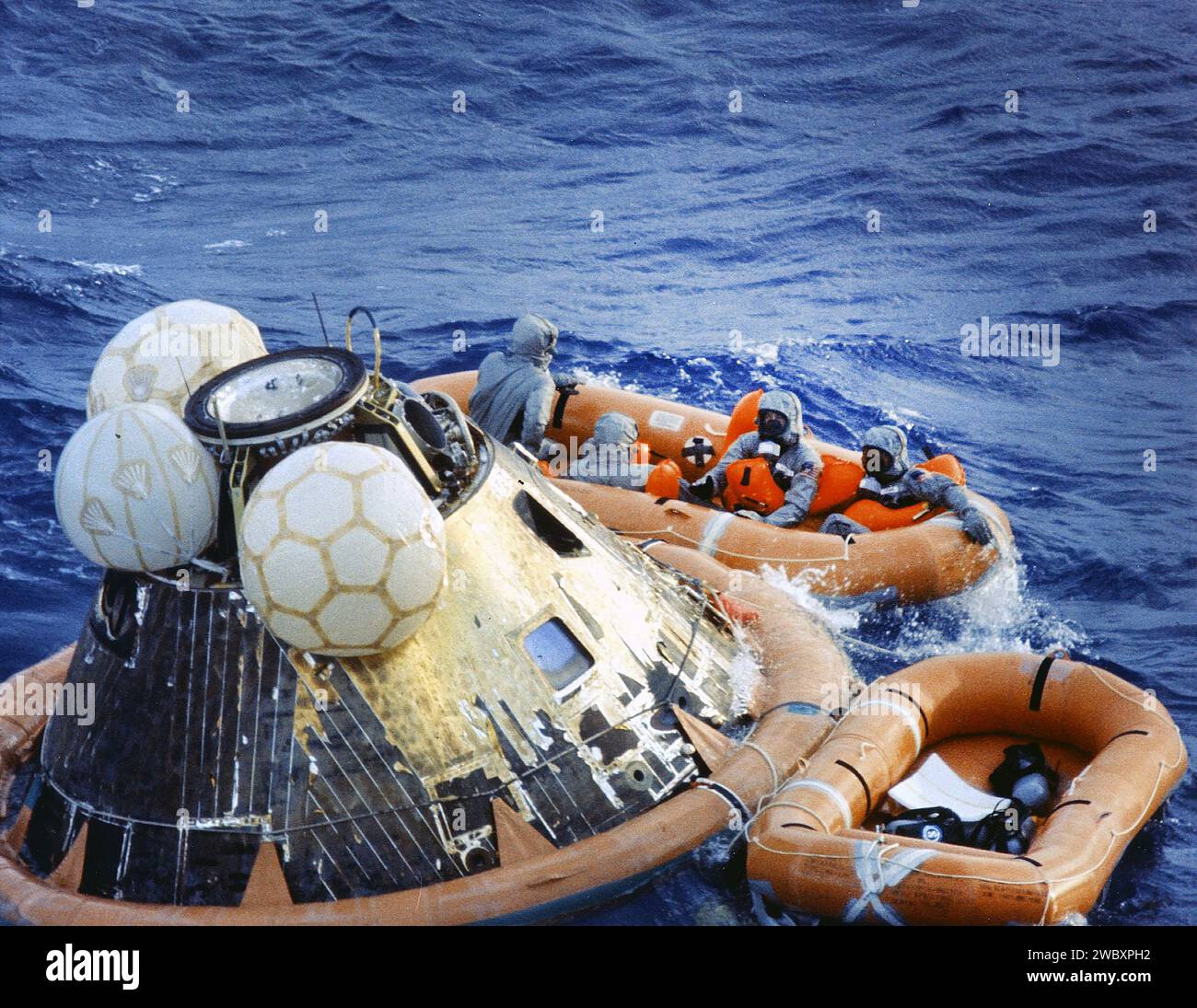 American Astronauts Edwin E. Aldrin, Neil A. Armstrong and Michael Collins in decontamination  raft during recovery operation of Command Module Columbia  after successful Apollo 11 mission, the first manned lunar mission, Pacific Ocean, NASA, July 24, 1969 Stock Photo