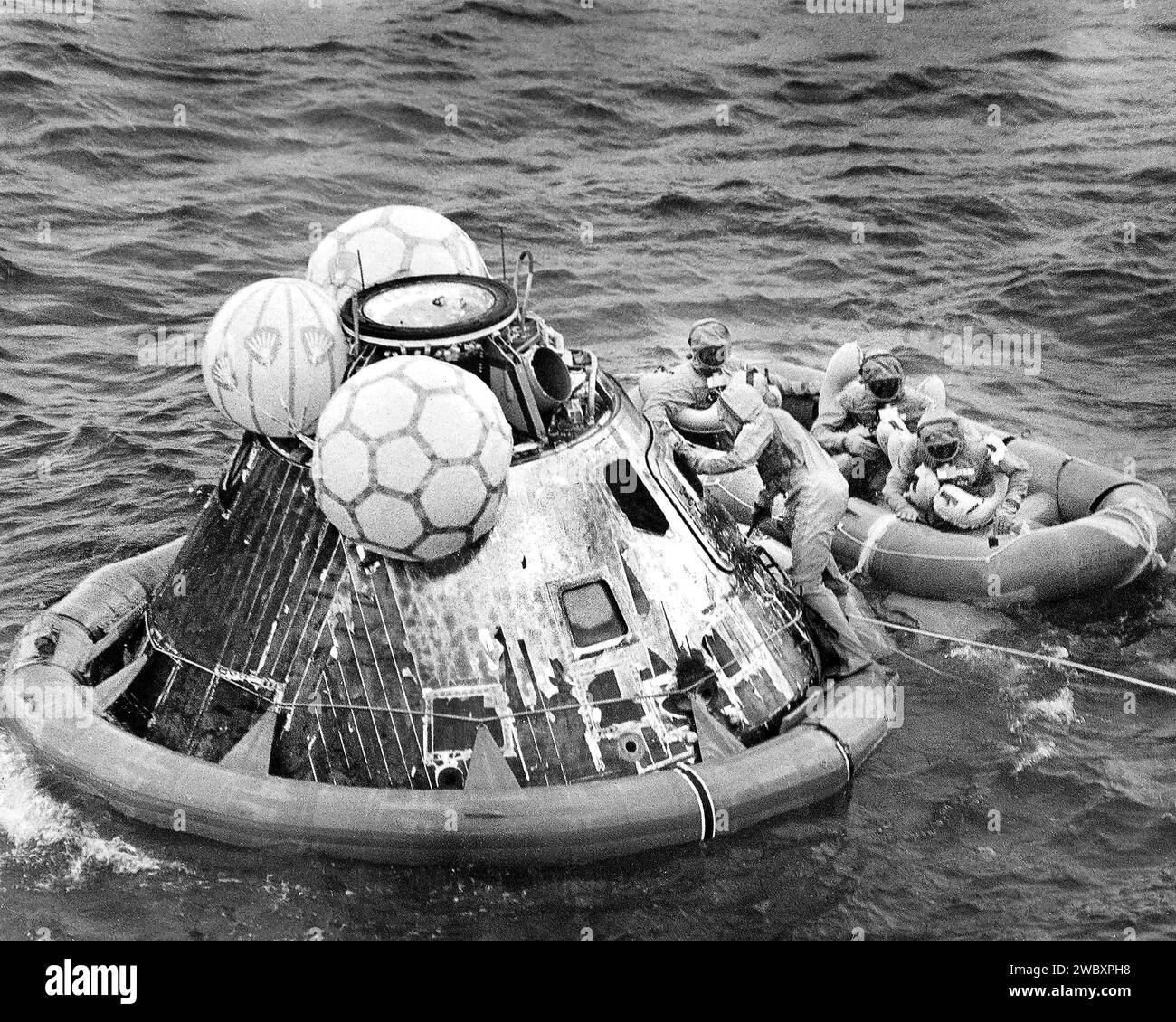 American Astronauts Edwin E. Aldrin, Neil A. Armstrong and Michael Collins in life raft during recovery operation of Command Module Columbia after successful Apollo 11 mission, the first manned lunar mission, Pacific Ocean, NASA, July 24, 1969 Stock Photo