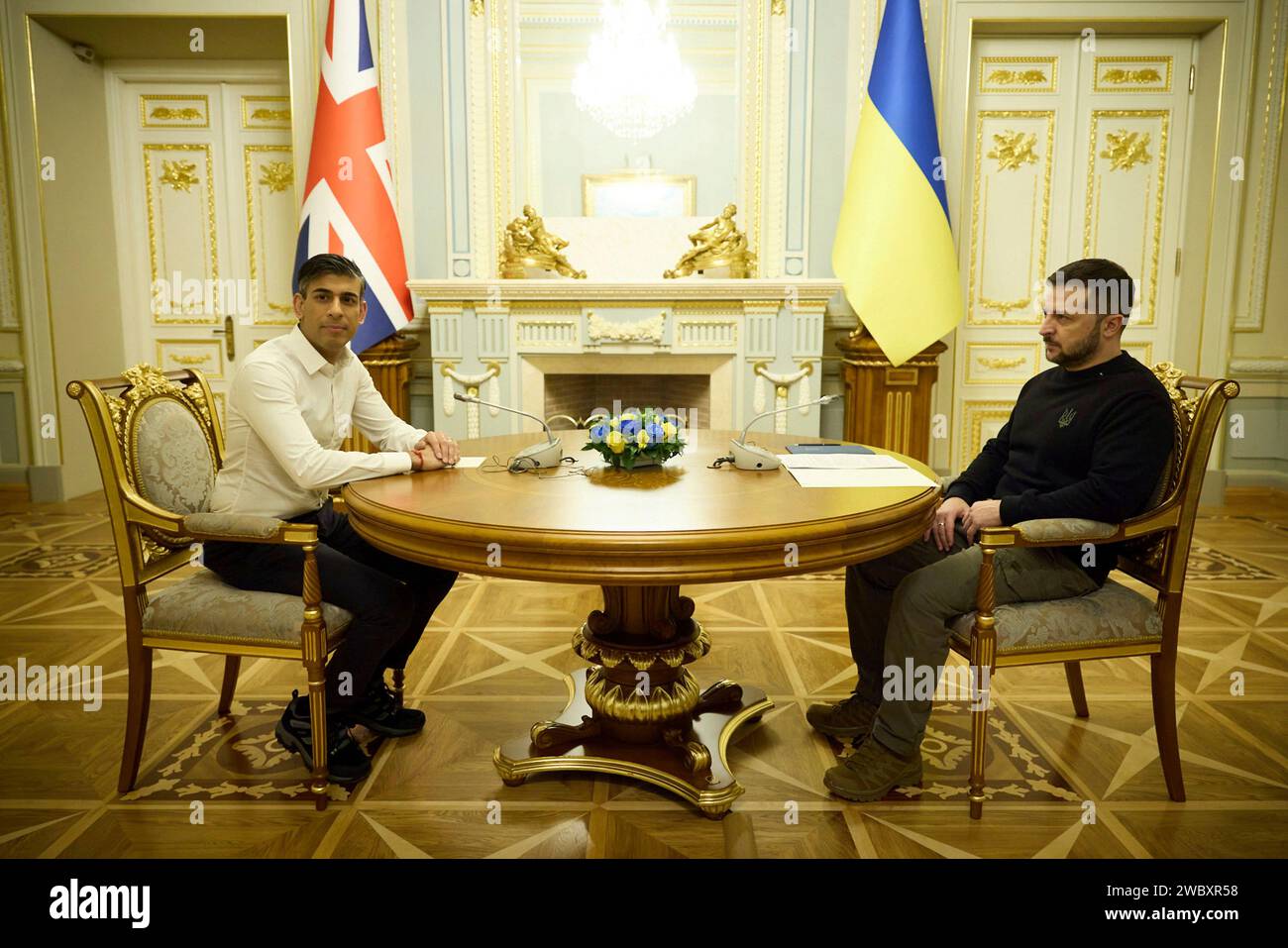 Kiev, Ukraine. 12th Jan, 2024. Ukrainian President Volodymyr Zelenskyy, right, poses for a photo
