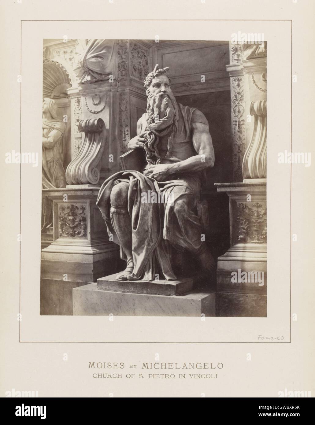 Moses sculpture by Michelangelo in the San Pietro in Vincoli in Rome, Anonymous, c. 1875 - c. 1890 photograph Part of photo album with recordings of sights and artworks in Rome. San Pietro in Vincoli photographic support albumen print piece of sculpture, reproduction of a piece of sculpture. interior of church San Pietro in Vincoli Stock Photo