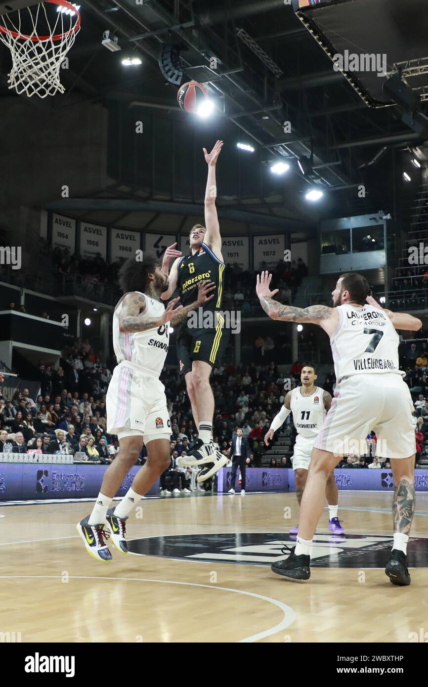 Malte DELOW of Alba Berlin and Mike SCOTT of Lyon and Joffrey LAUVERGNE of Lyon during the Turkish Airlines EuroLeague basketball match between LDLC ASVEL Villeurbanne and Alba Berlin on January 12, 2024 at Astroballe in Villeurbanne, France Stock Photo