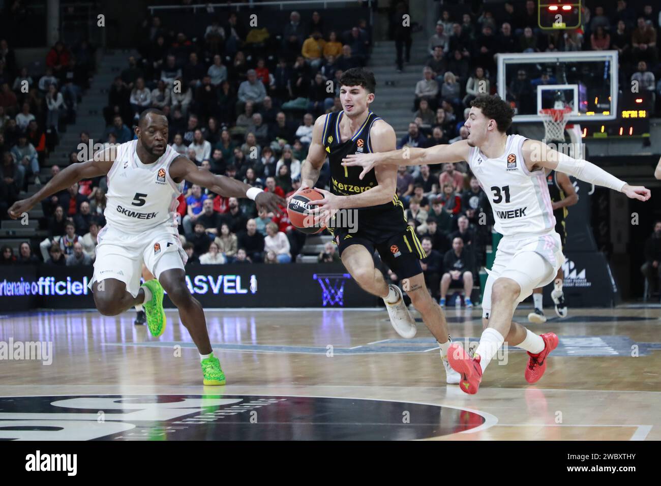 Gabriele PROCIDA of Alba Berlin and Noam YAACOV of Lyon and Charles KAHUDI of Lyon during the Turkish Airlines EuroLeague basketball match between LDLC ASVEL Villeurbanne and Alba Berlin on January 12, 2024 at Astroballe in Villeurbanne, France Stock Photo