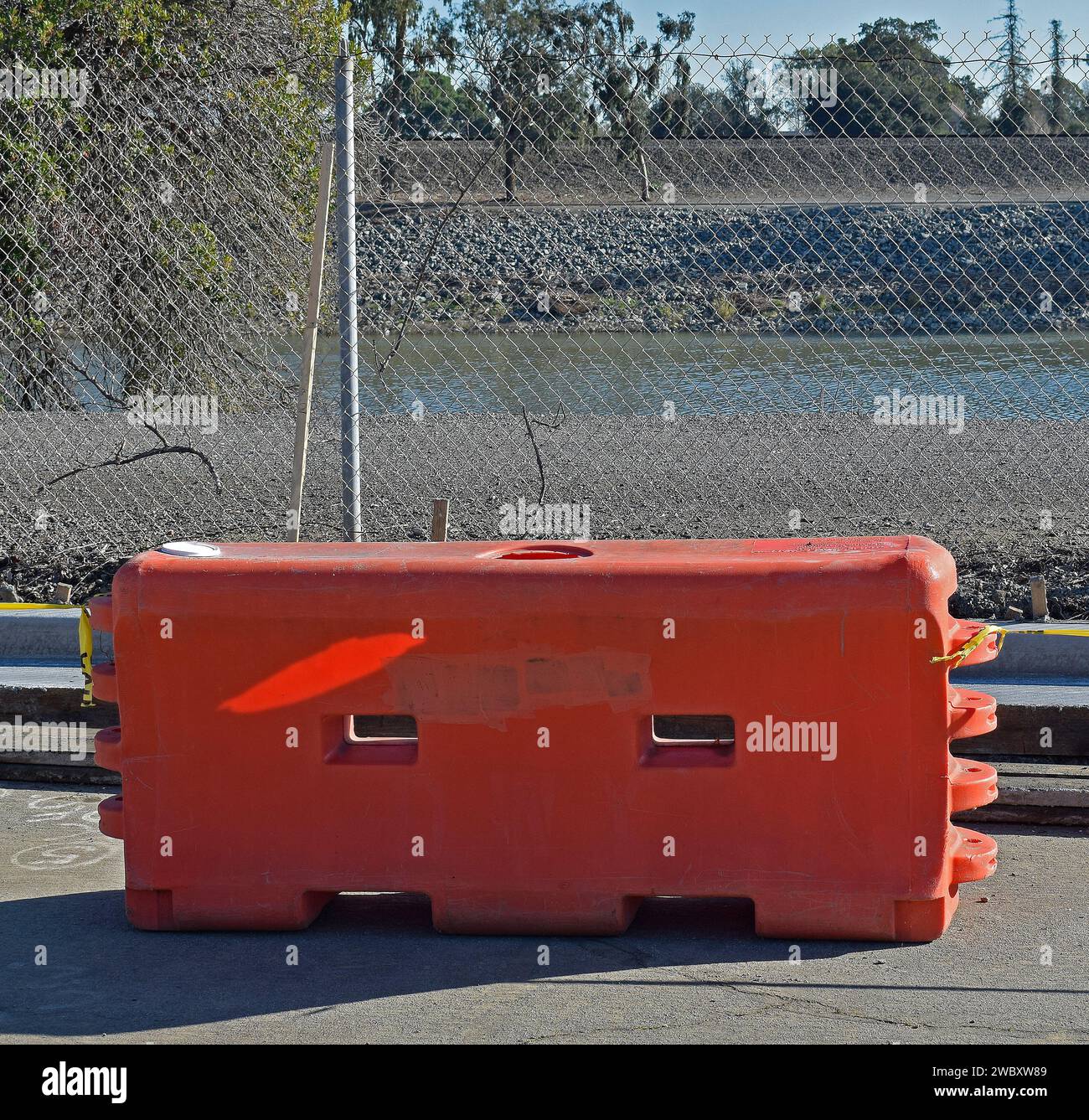 orange water fill plastic barricade in California Stock Photo
