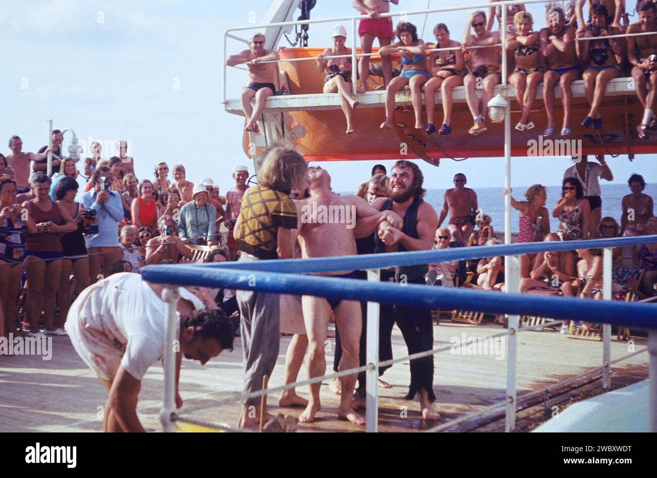 crowd of people, east germans, while entertainment on a east german cruise ship or liner, on the
