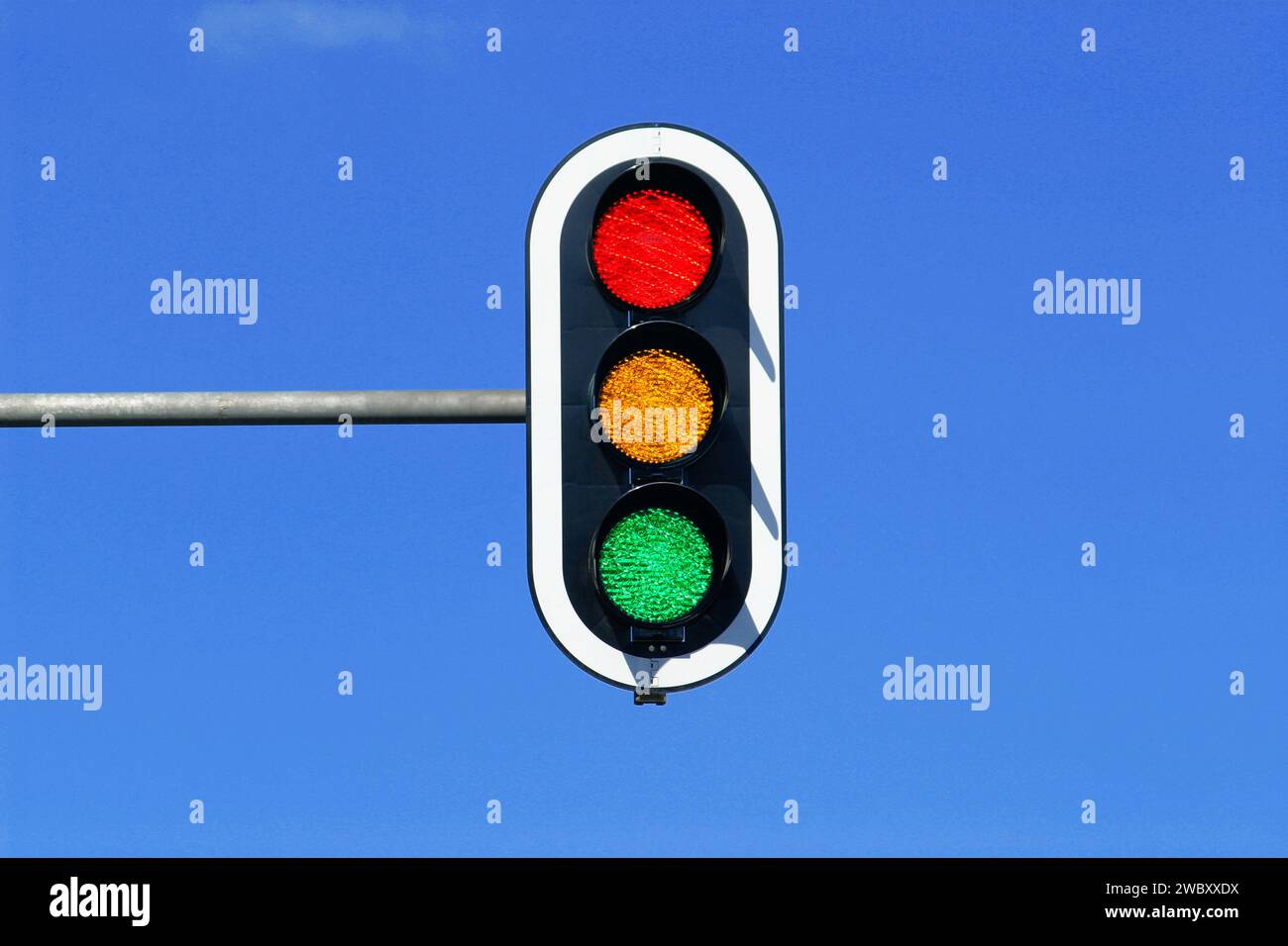 traffic light in blue sky with red, yellow and green lights on Stock Photo Alamy