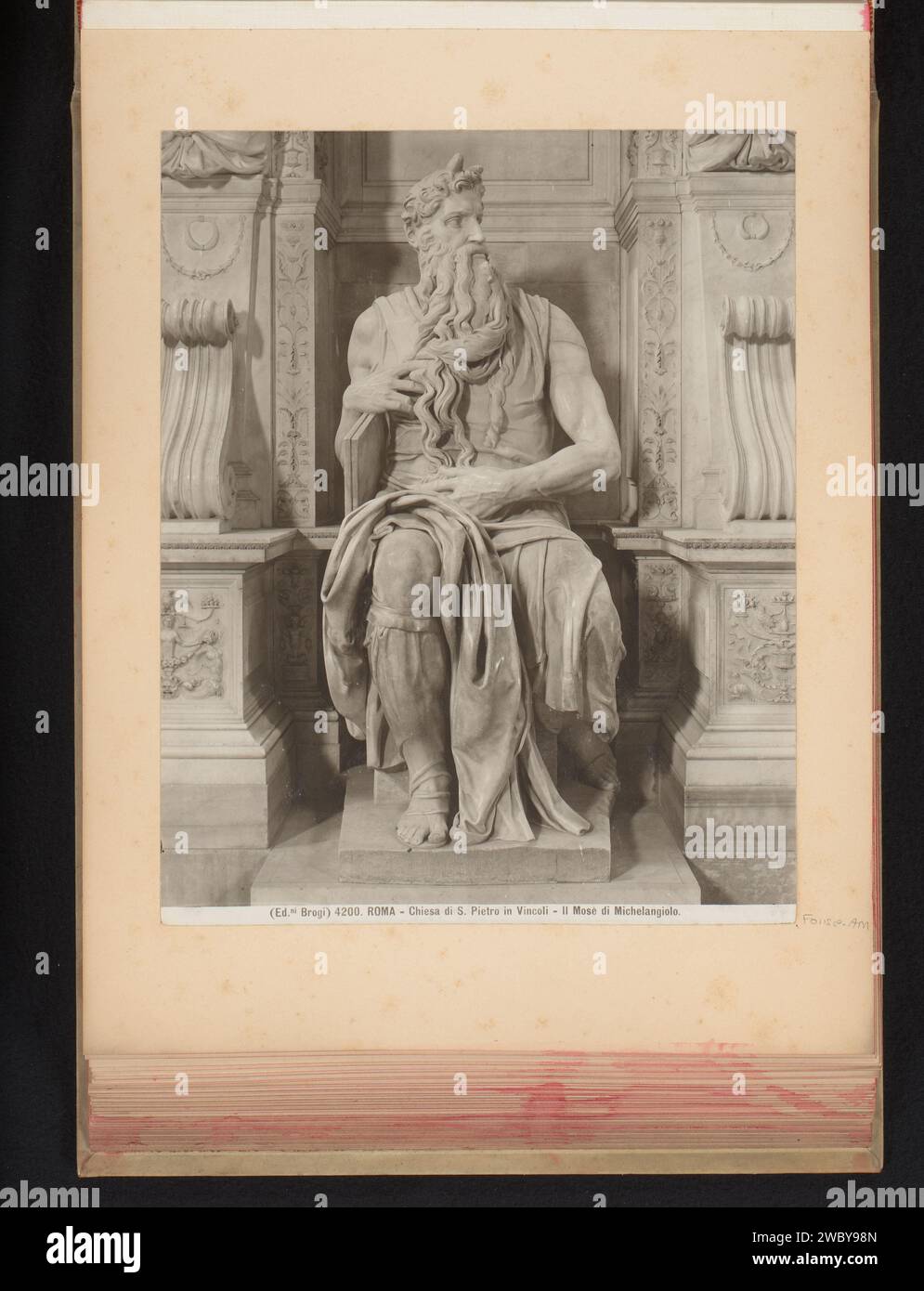 Sculpture in the San Pietro in Vincoli, representing Mozes, Edizione Brogi, c. 1875 - In or Before 1907 photograph Part of photo album with recordings of sights and artworks in Italy. San Pietro in Vincoli photographic support gelatin silver print sculpture. Moses (not in biblical context); possible attributes: rays of light or horns on his head, rod, Tables of the Law Stock Photo