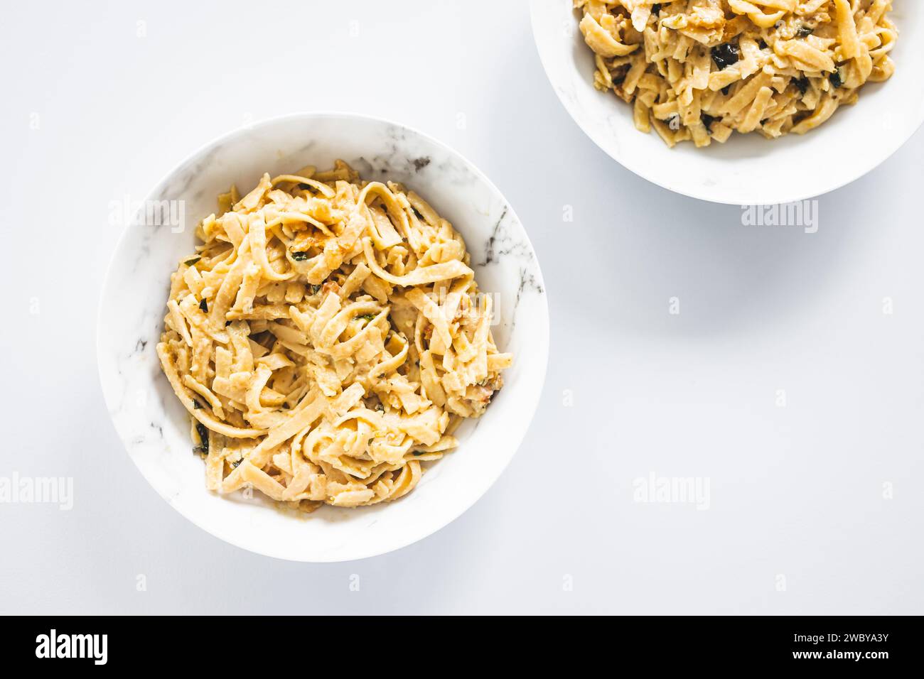 plant-based  fettuccini pasta with creamy lemon sauce, healthy vegan food recipes Stock Photo