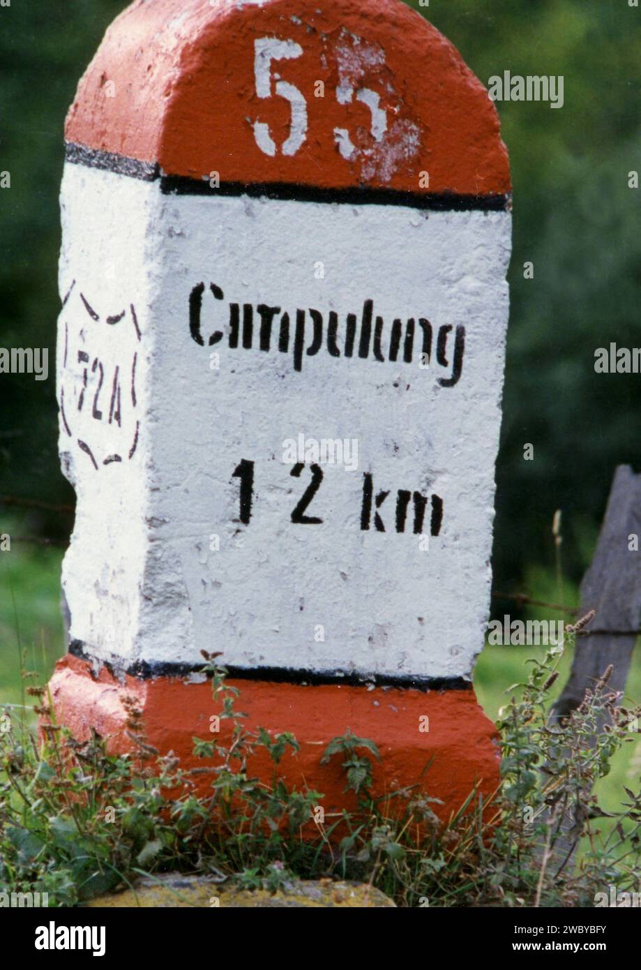 Argeș County, Romania, cca 1992. Landscape in the countryside. Distance marker on the side of a road. Stock Photo