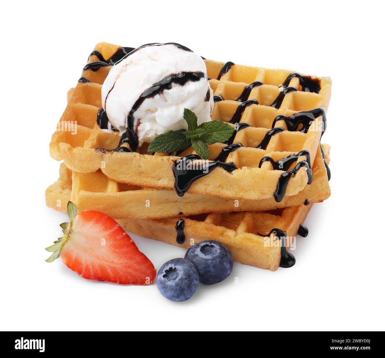 Tasty Belgian waffles with ice cream, berries and chocolate syrup on ...
