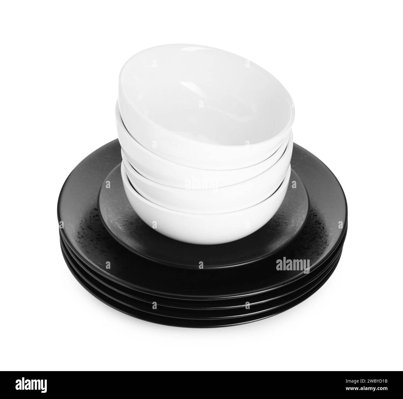 Stack of beautiful ceramic plates and bowls isolated on white Stock