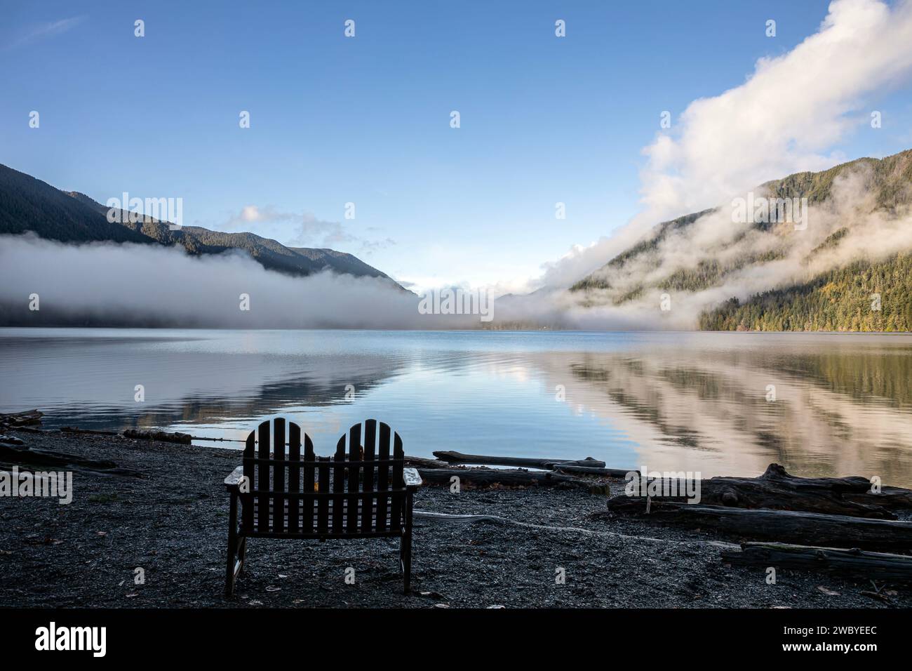 WA23925-00...WASHINGTON - Outdoor chair on the shore of Lake Crescent ...