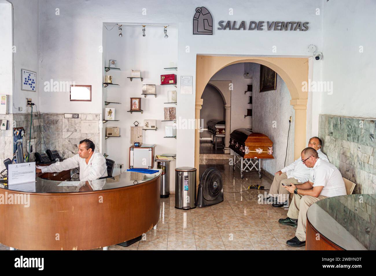 Merida Mexico,centro historico central historic district,inside interior,funeral home casket coffin,employees man men male,adult,resident,residents,sa Stock Photo