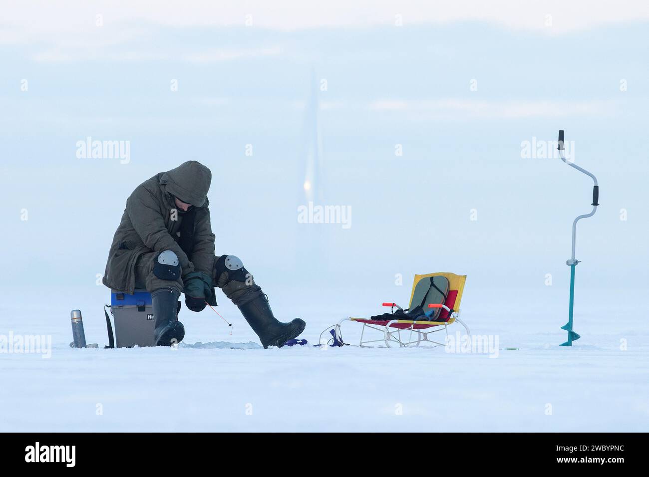 Man ice fishing in finland hi-res stock photography and images - Alamy
