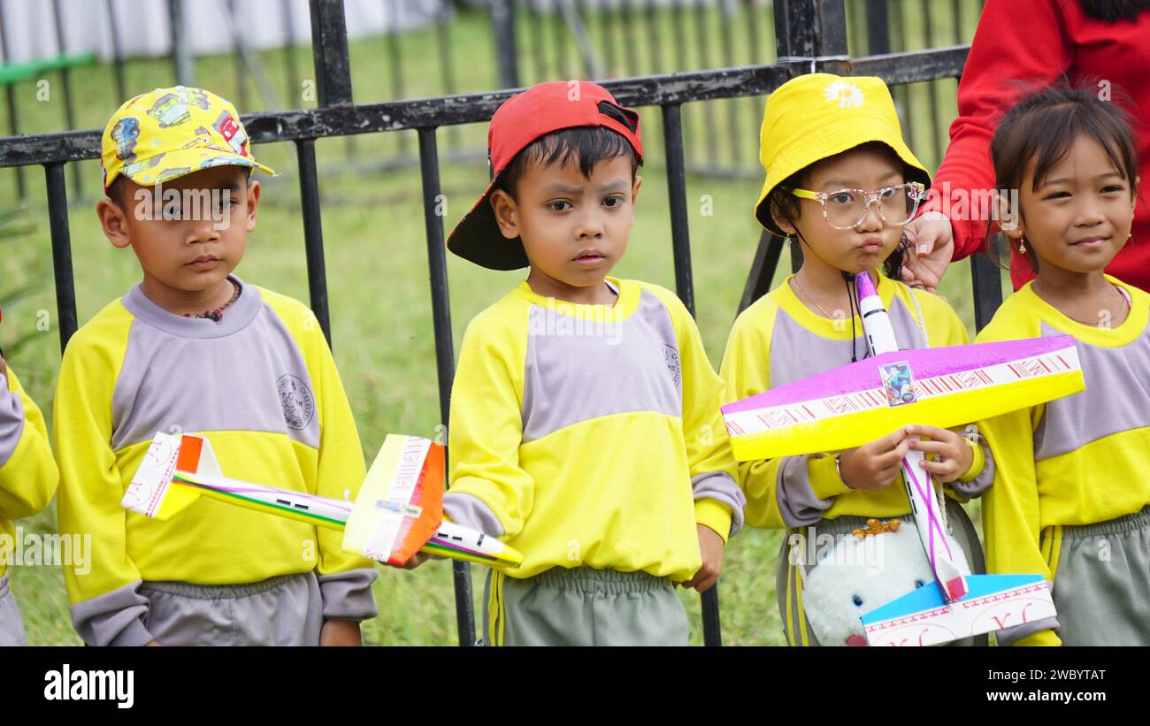 Kindergarten student play toy plane with friends Stock Photo Alamy