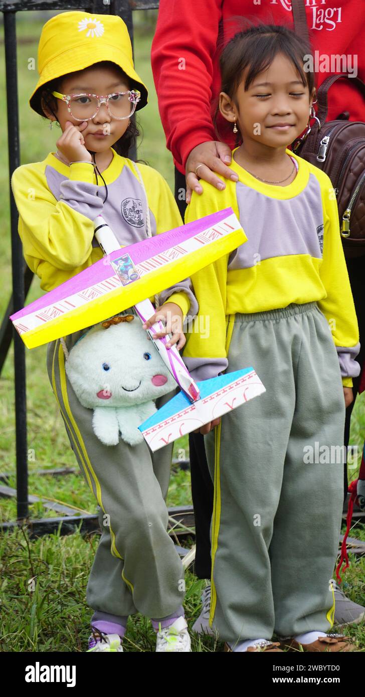 Kindergarten student play toy plane with friends Stock Photo Alamy