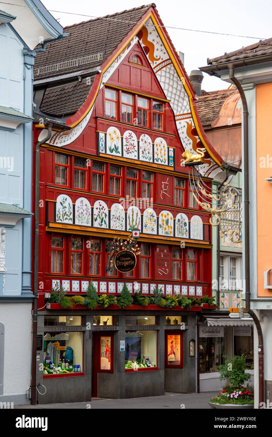 This colorful Appenzeller style building houses the Löwen Drogerie, a local pharmacy in Appenzell, Innerrhoden, Switzerland. Stock Photo