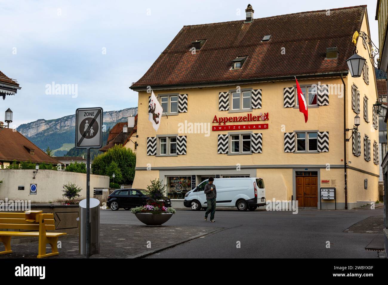 A man walks past the Appenzeller Cheese shop in Appenzell, Innerrhoden, Switzerland. Stock Photo