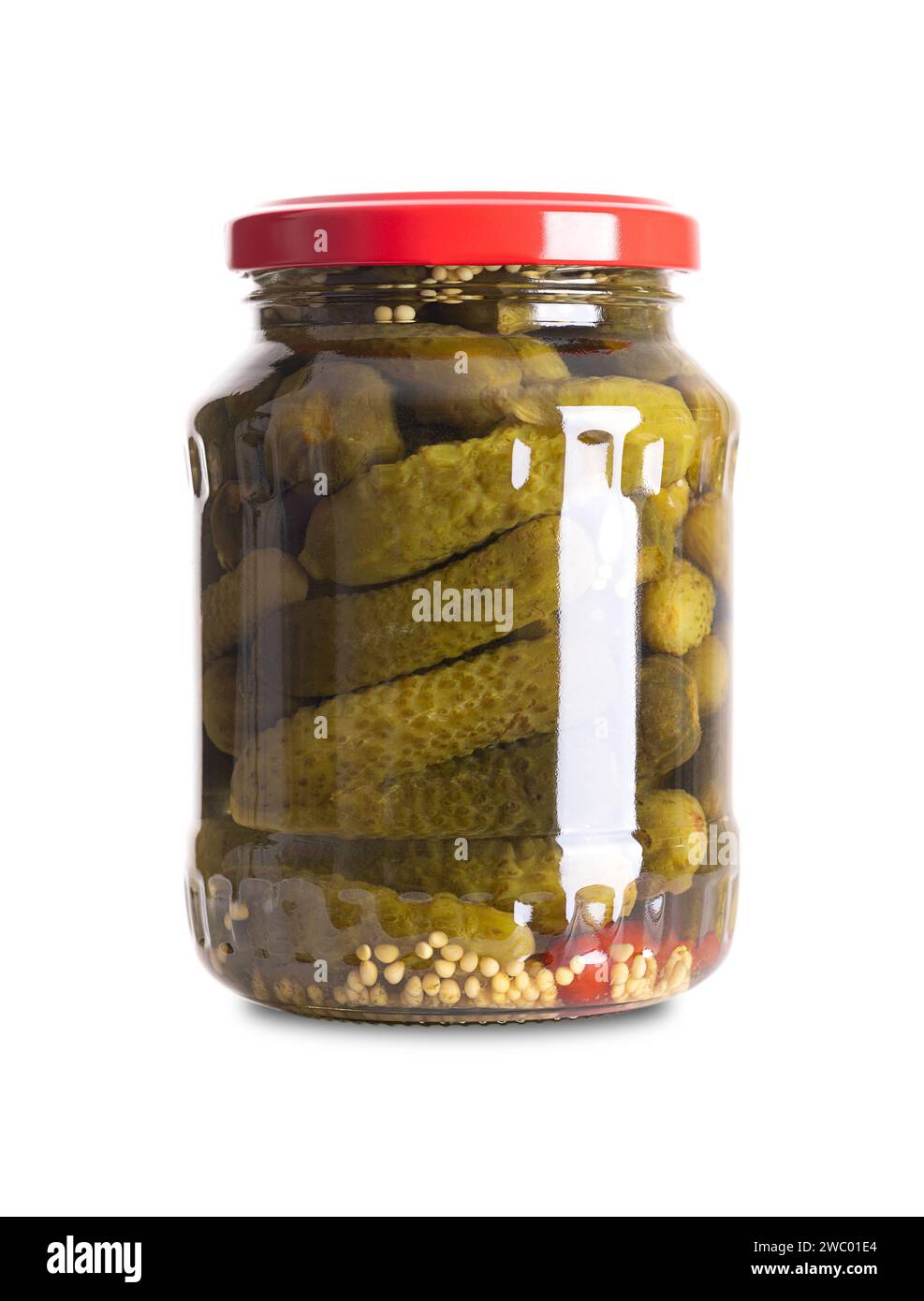 Cornichons, pickled gherkins in glass jar. Small pickles, cucumbers