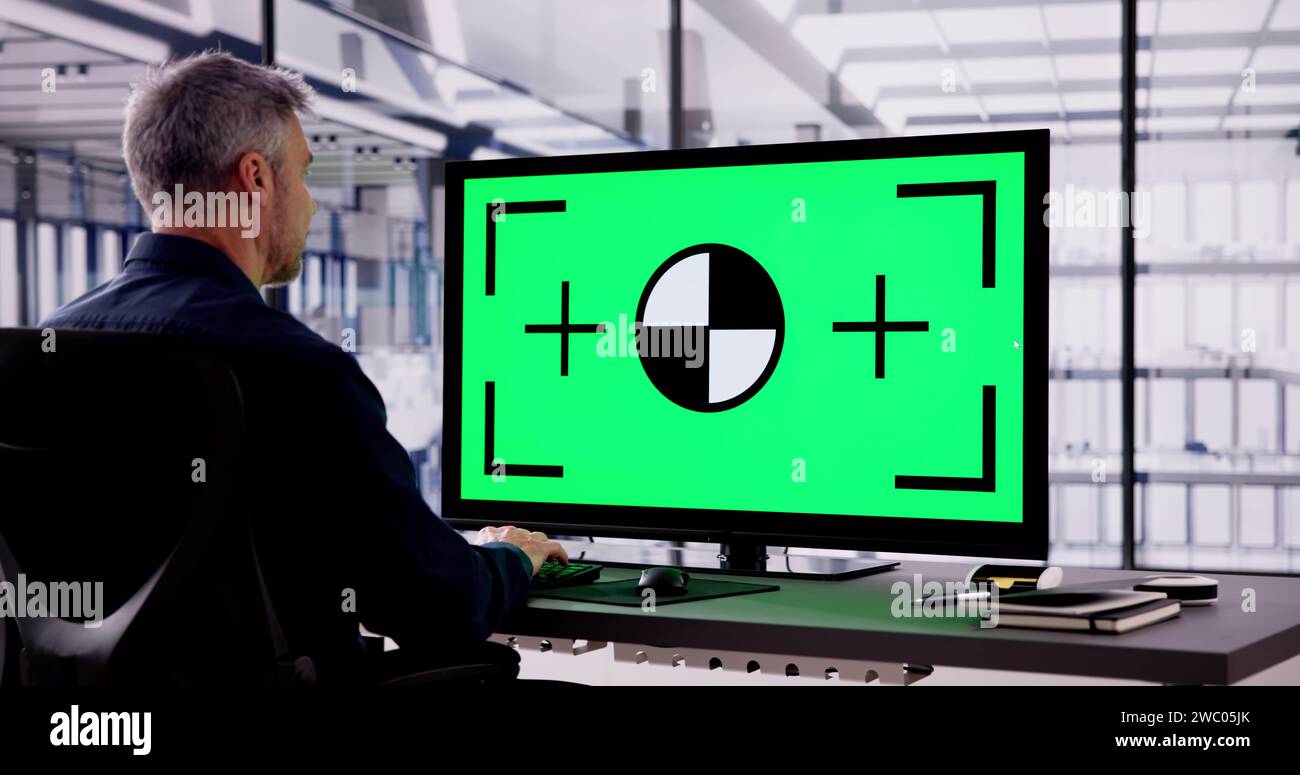 Business Man Using Desktop With Green Screen Stock Photo