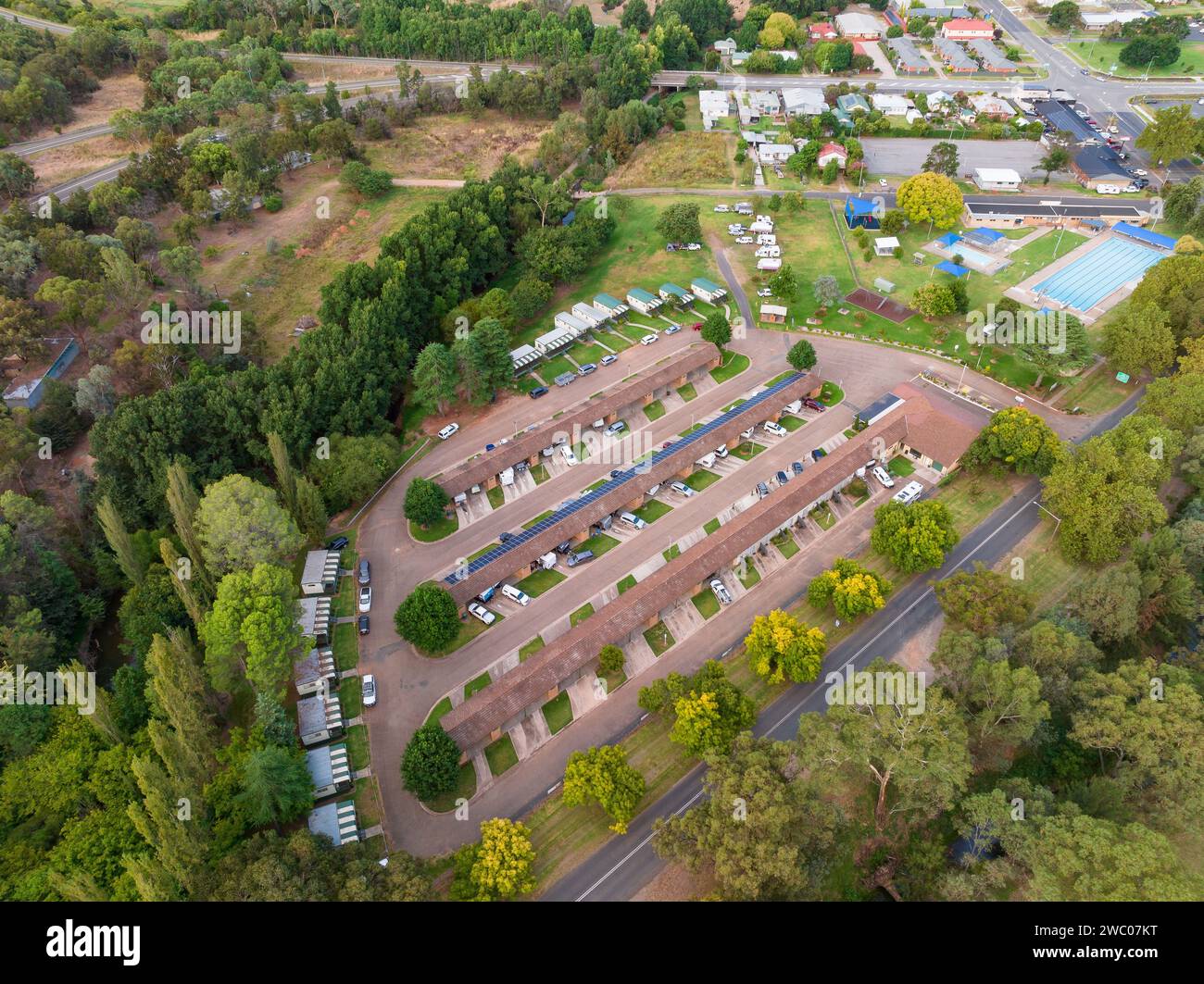 Aerial view over a caravan park in a rural town surrounded by green trees at Gundagai in New South Wales, Australia Stock Photo