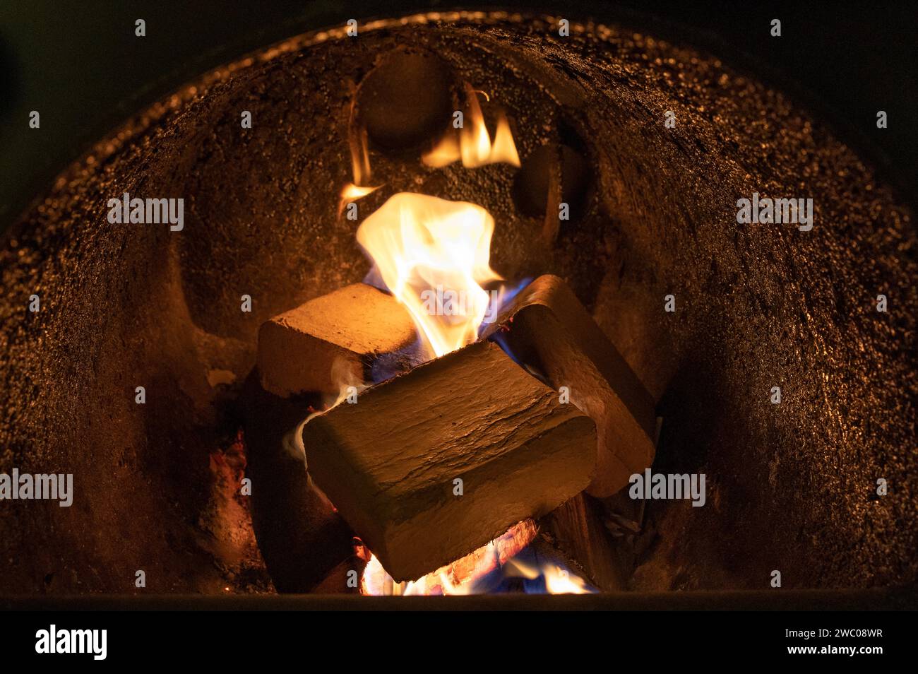 Wood briquettes (ruf type), made of beech and oak burning inside the