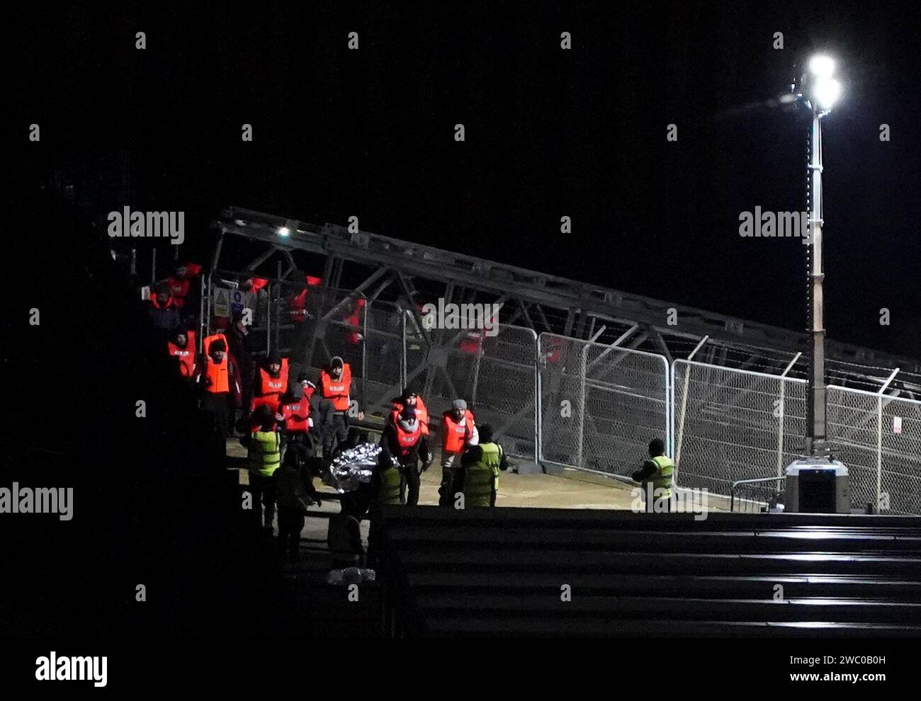 A group of people thought to be migrants are brought in to Dover, Kent, from a Border Force vessel following a small boat incident in the Channel. Picture date: Saturday January 13, 2024. Stock Photo