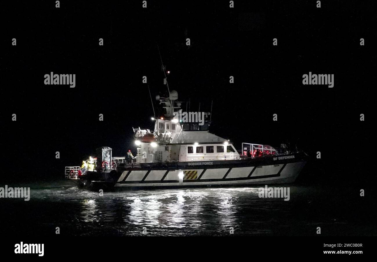 A group of people thought to be migrants are brought in to Dover, Kent, onboard a Border Force vessel following a small boat incident in the Channel. Picture date: Saturday January 13, 2024. Stock Photo