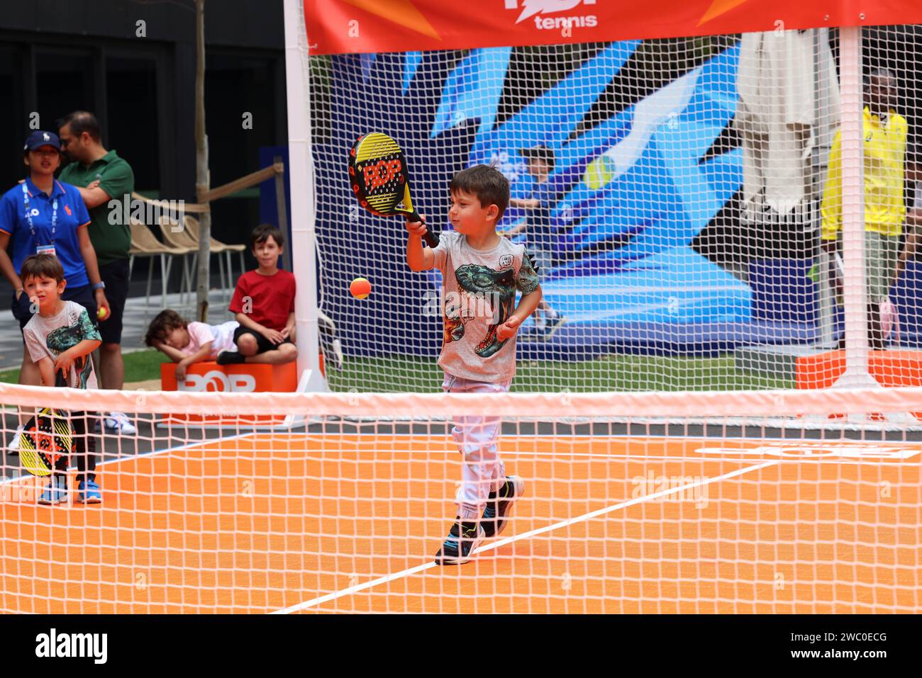 Melbourne, Australia. 13th Jan, 2024. A boy enjoys tennis during the