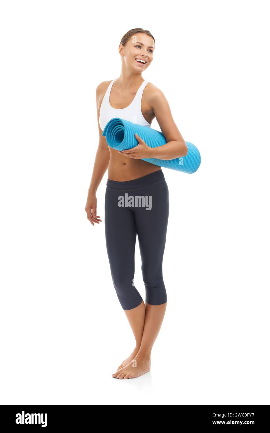 Sporty slim woman holding blue yoga mat Stock Photo - Alamy