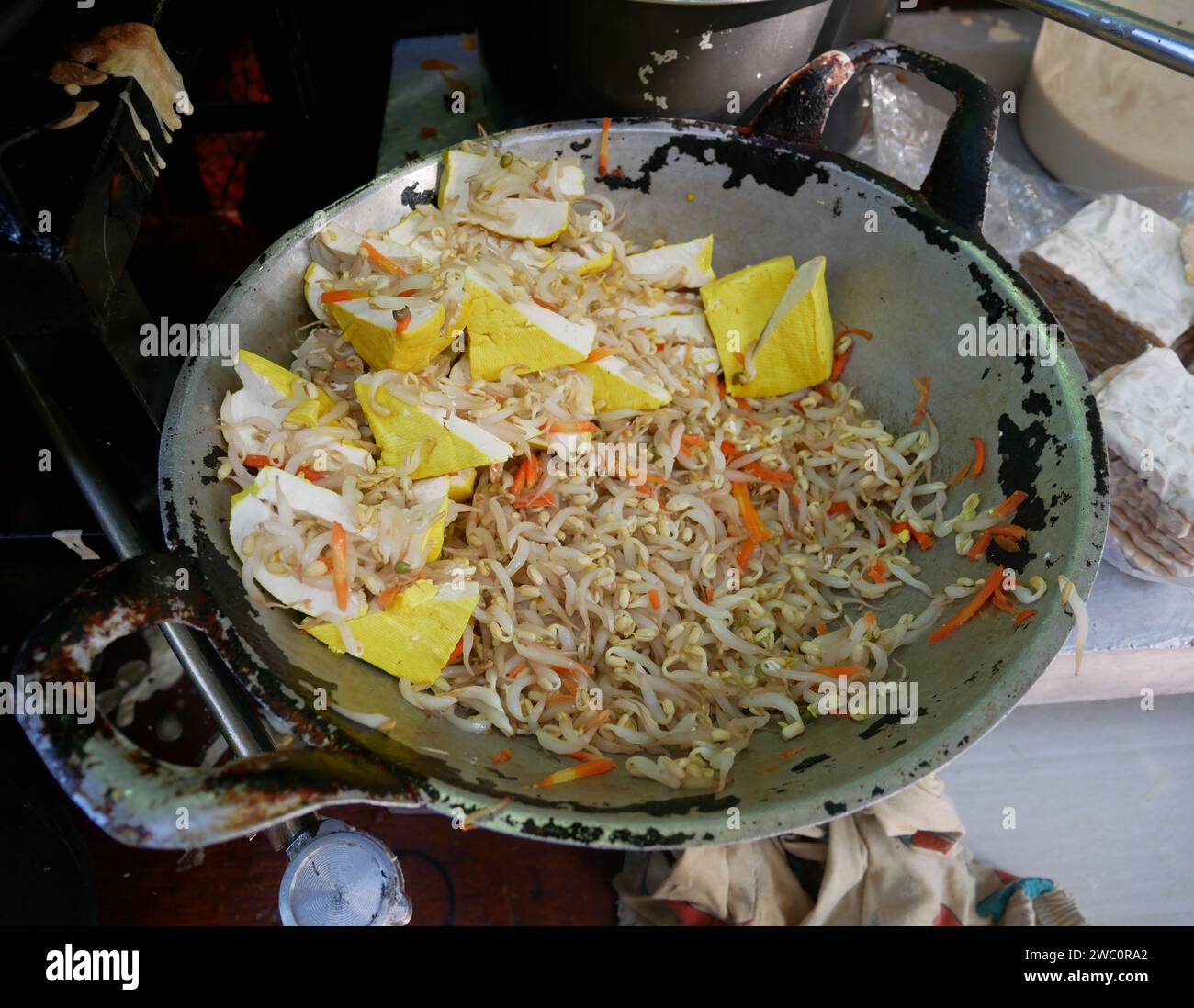 A street food wok with tahu isi or deep fried tofu snacks with fillings cooking in Bandung, West Java, Indonesia. Stock Photo