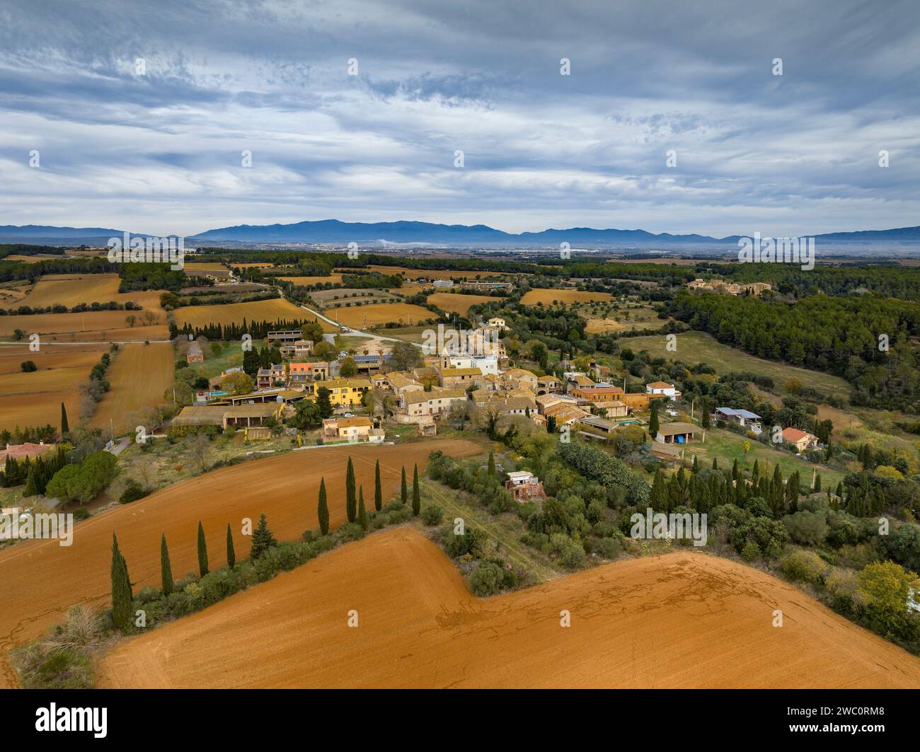 Aerial view of the municipality of Palau de Santa Eulàlia and its rural surroundings on a cloudy winter morning. Alt Empordà, Girona, Catalonia, Spain Stock Photo