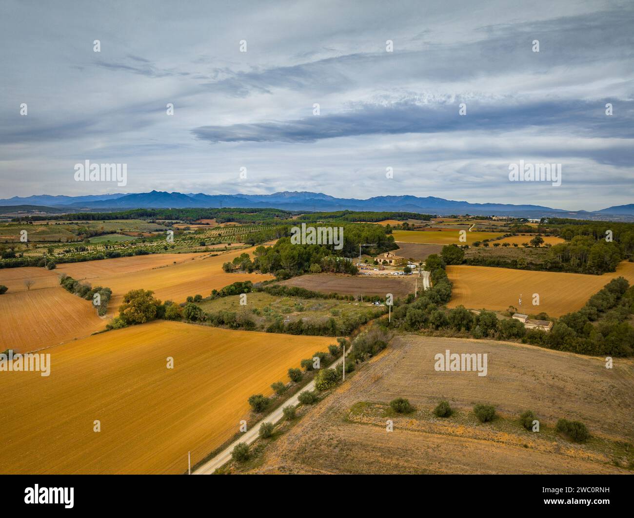 Aerial view of the municipality of Palau de Santa Eulàlia and its rural surroundings on a cloudy winter morning. Alt Empordà, Girona, Catalonia, Spain Stock Photo