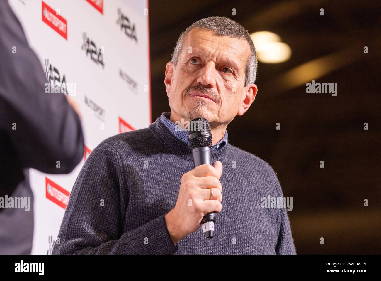 Birmingham, UK. 13 Jan, 2024. Former Haas team principle Gunther Steiner as he chats to Sky Sports F1 Commentator David 'Crofty' Croft at the main stage of Autosport International 2024. Credit Milo Chandler/Alamy Live News Stock Photo