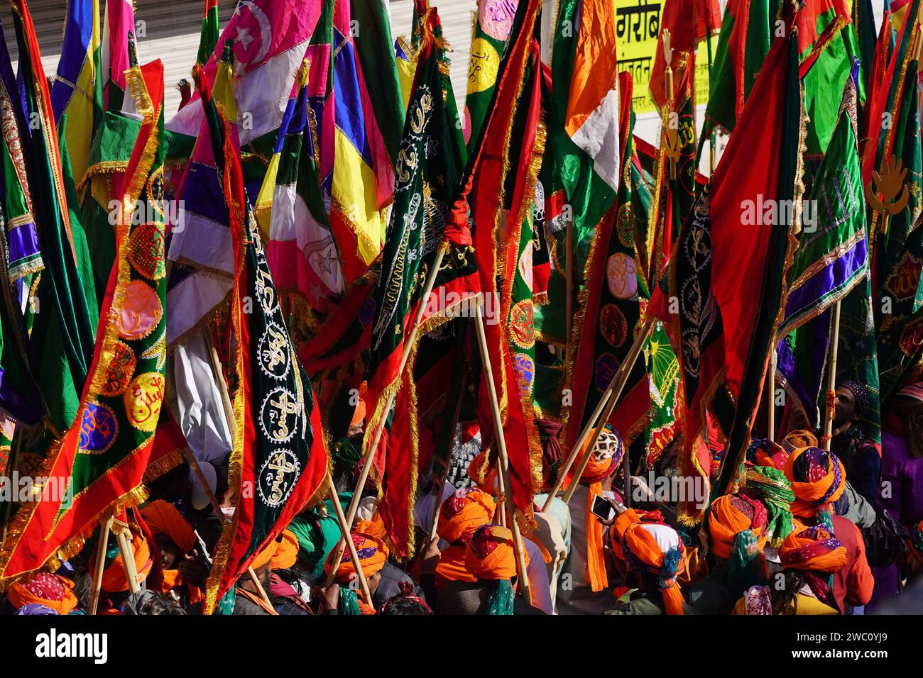 Ajmer, India. 13th Jan, 2024. Indian Muslim devotees carry holy flags ...