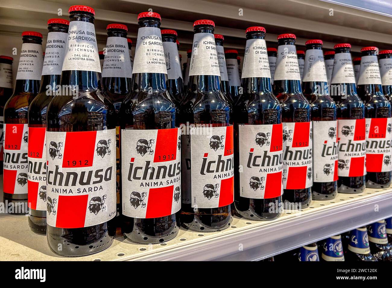 Italy January 11, 2024 Ichnusa beer in glass bottle on shelves for