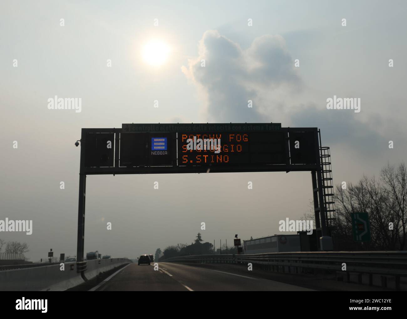 portal with motorway sign indicating that there is a lot of fog in the