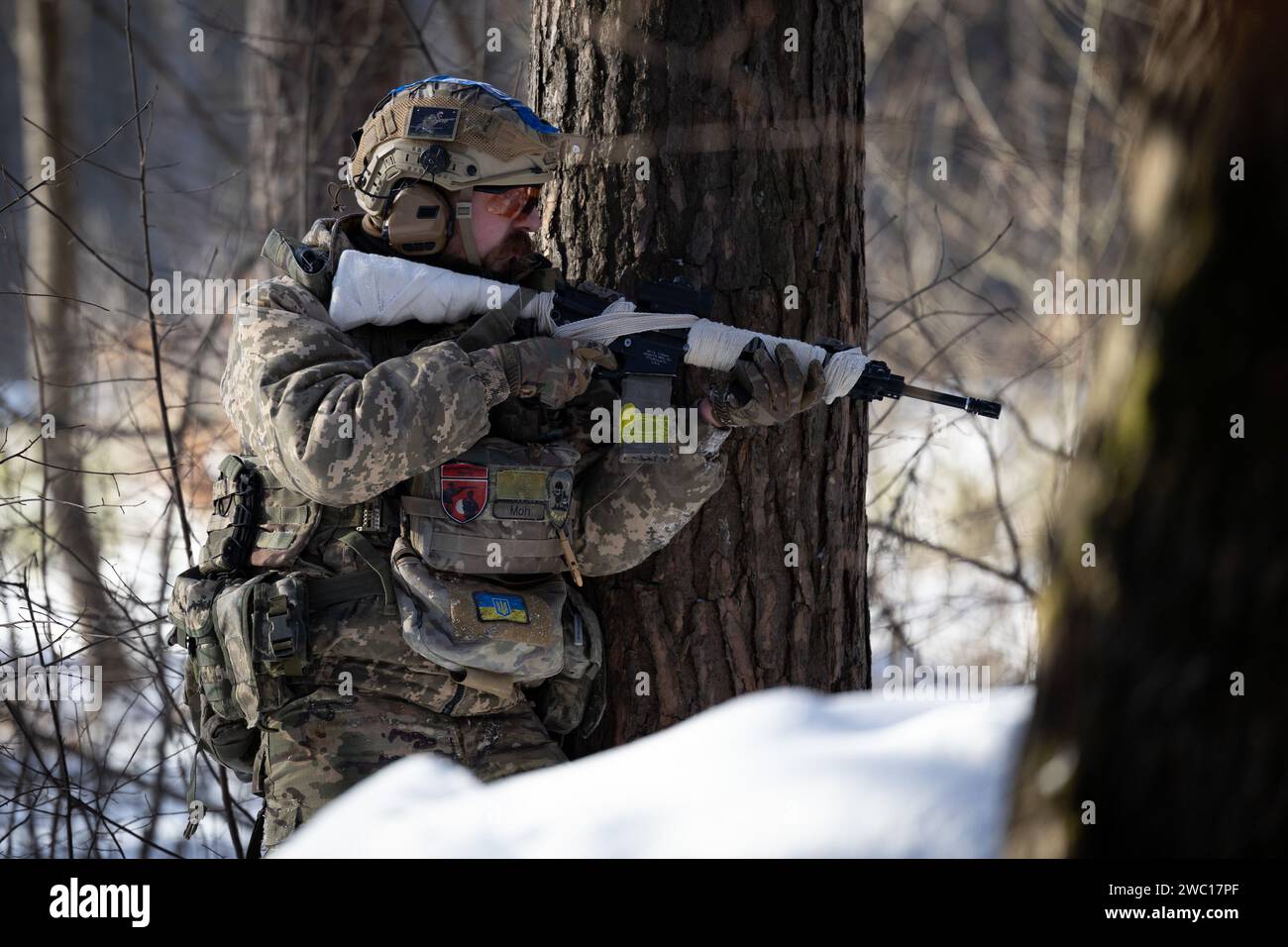 Ukrainian civilian performs the role of a sniper of an assault group