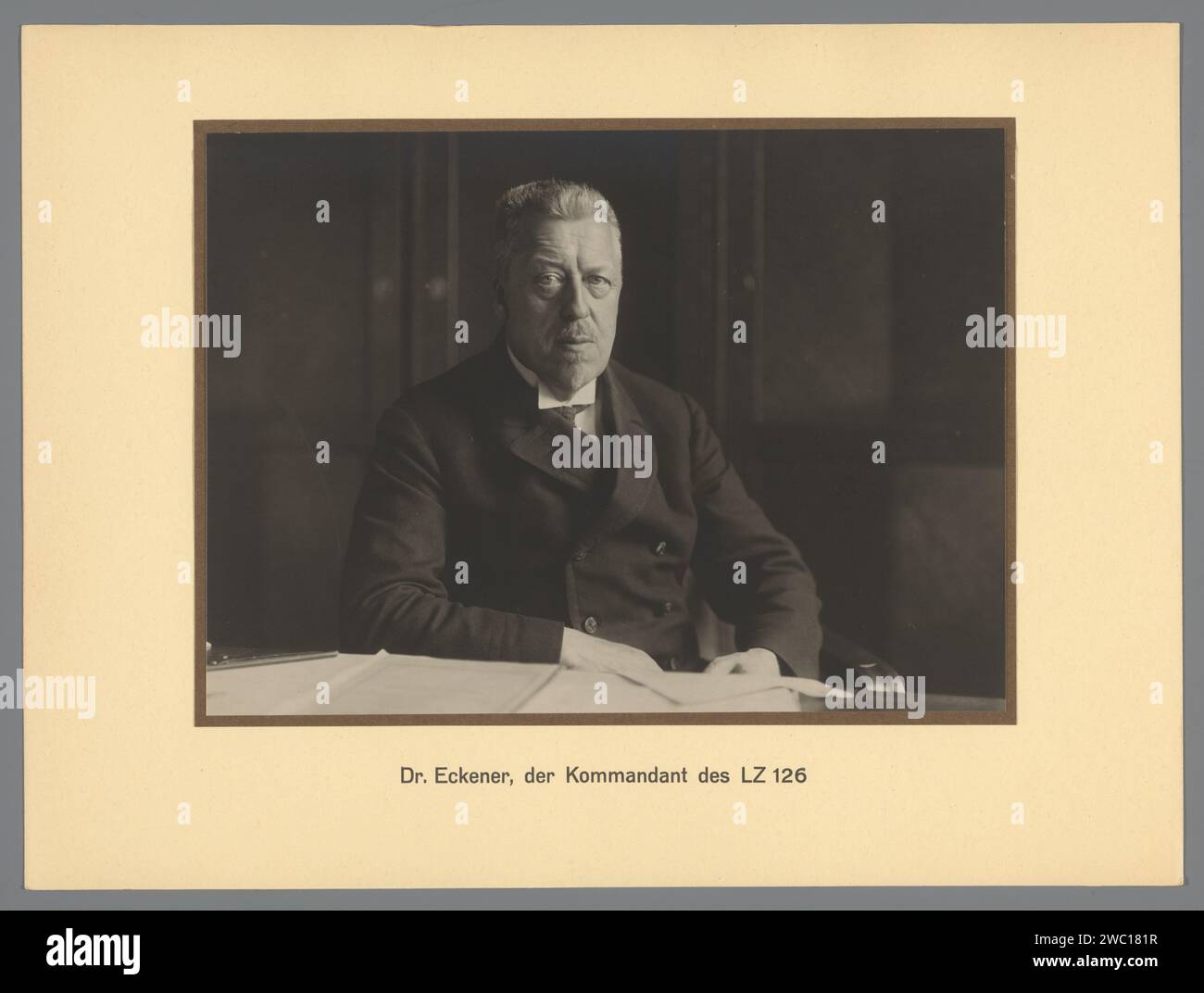 Portrait of Dr. Hugo Eckener, the commander of the LZ 126, Anonymous, 1924 photograph Portrait of director Dr. Hugo Eckener, the commander of the LZ 126, sitting behind the desk. Part of a folder of twenty product photos of the Zeppelin air ship LZ 126. Germanypublisher: Friedrichshafen cardboard. photographic support gelatin silver print historical persons. 46C35 airship, zeppelin Stock Photo