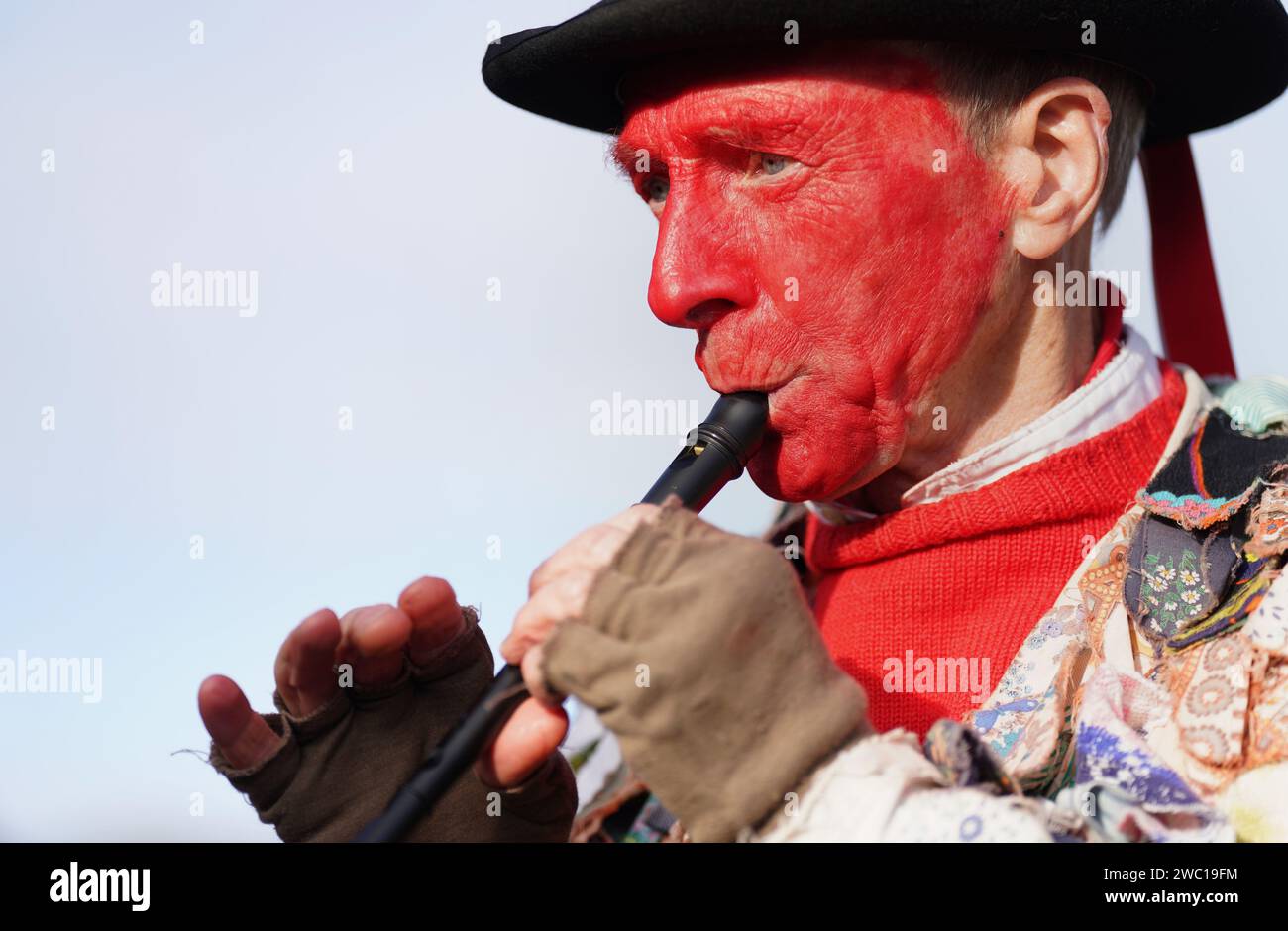 Red Leicester Morris dancers perform as the Straw Bear is paraded