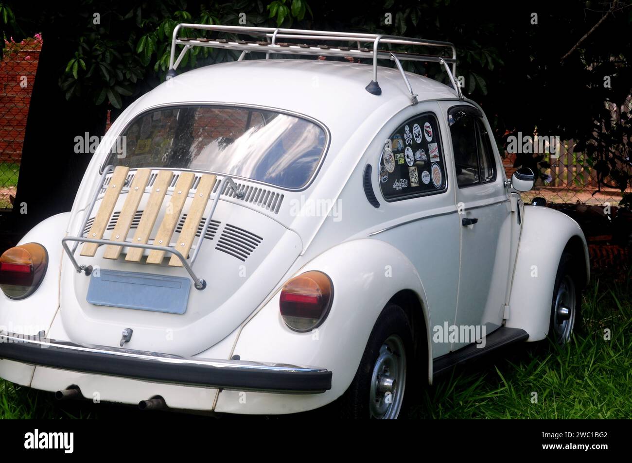 White Beetle passenger car with rear luggage rack on top. Stock Photo