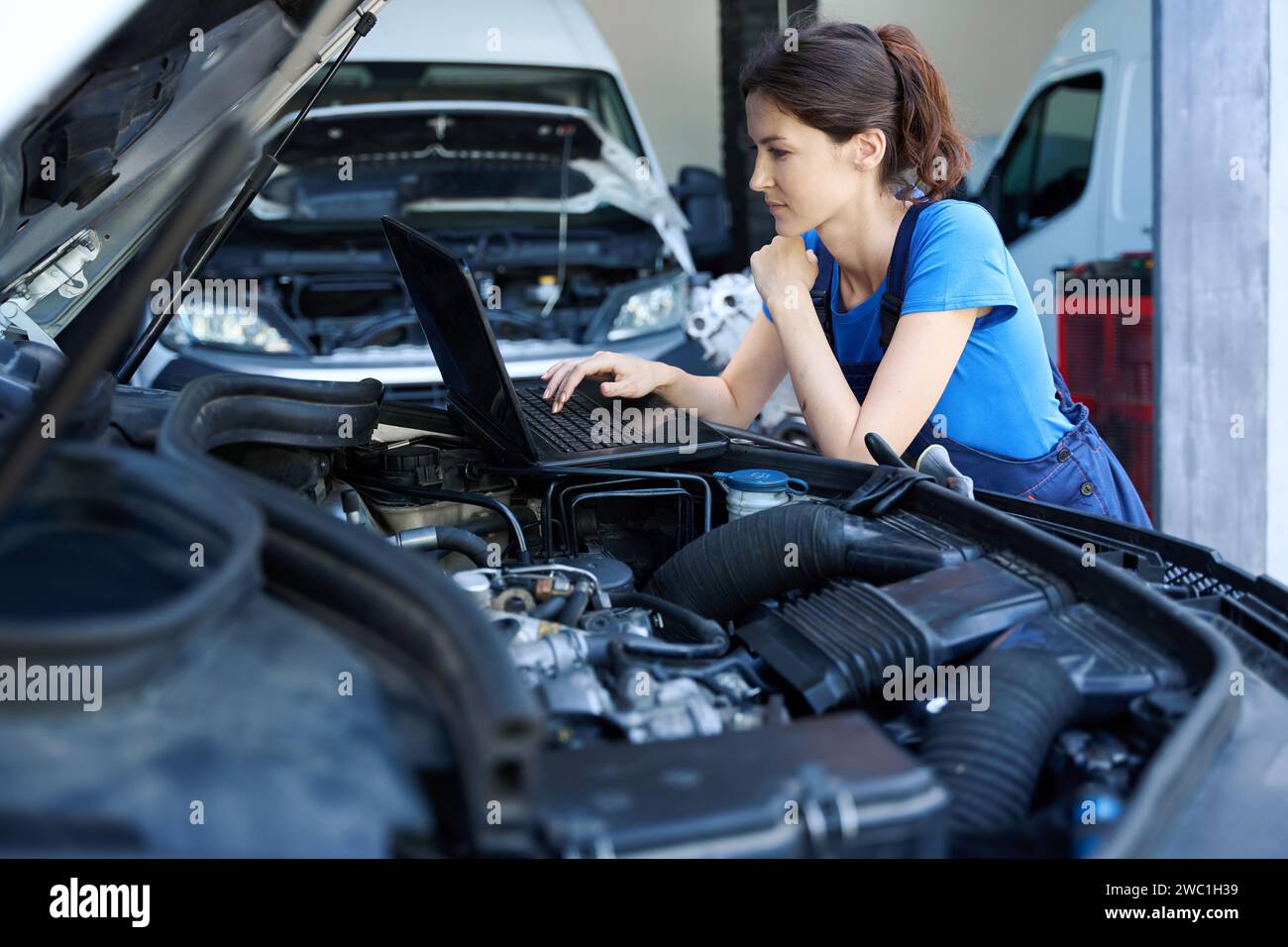 Caucasian female auto mechanic uses hi-res stock photography and images ...