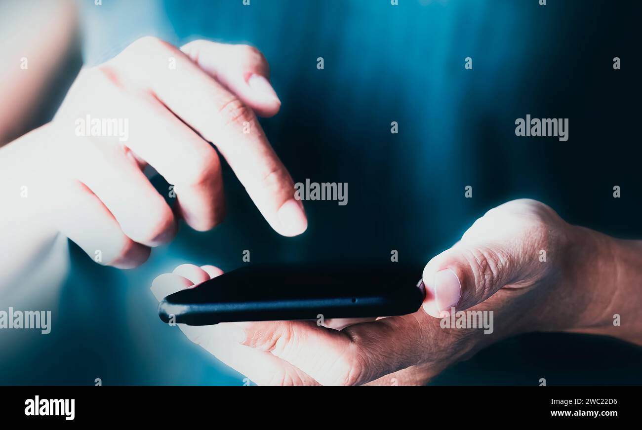 Hand using smartphone. Technology and communication concept. Stock Photo