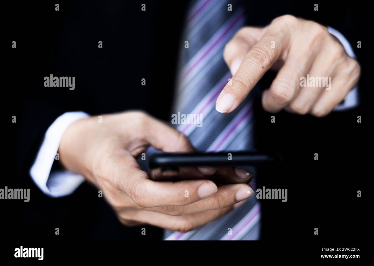 Hand using smartphone. Technology and communication concept. Stock Photo