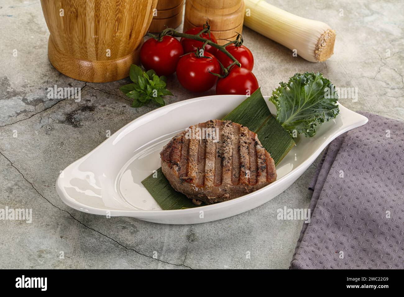 Grilled tuna medallion in the plate with spices Stock Photo Alamy