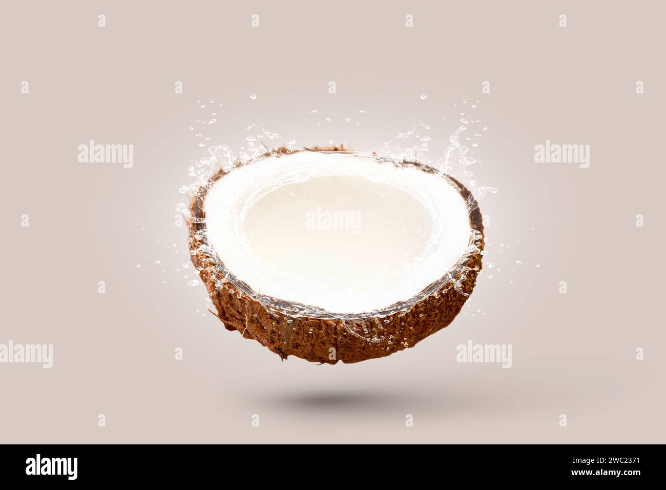 Coconuts water splash top view isolated on the white background Stock Photo
