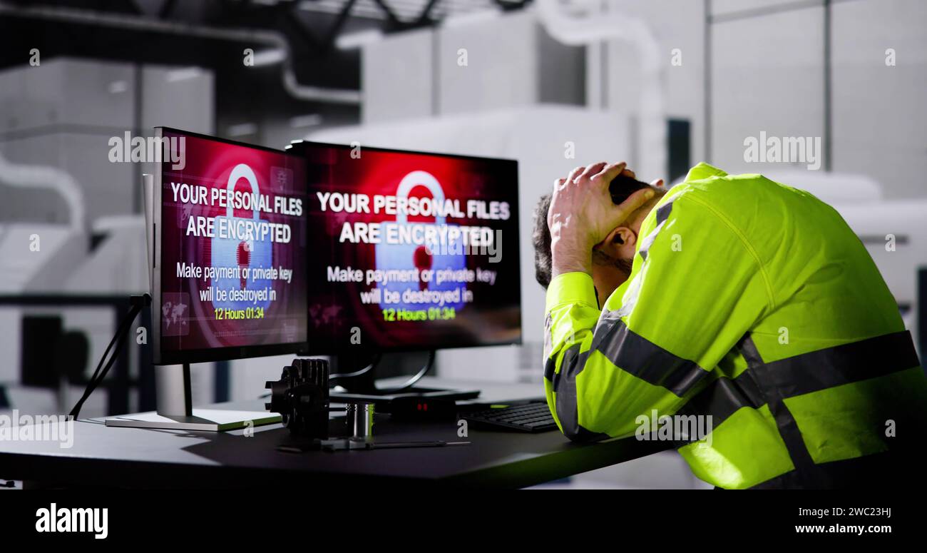Shocked Engineer In Automated Semiconductor Factory During Ransomware Attack Stock Photo