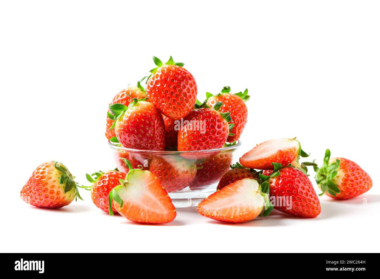 Strawberry on glass isolated on white background. Strawberries with leaf isolate. Whole and half of strawberry on white. Strawberries isolate. Side vi Stock Photo