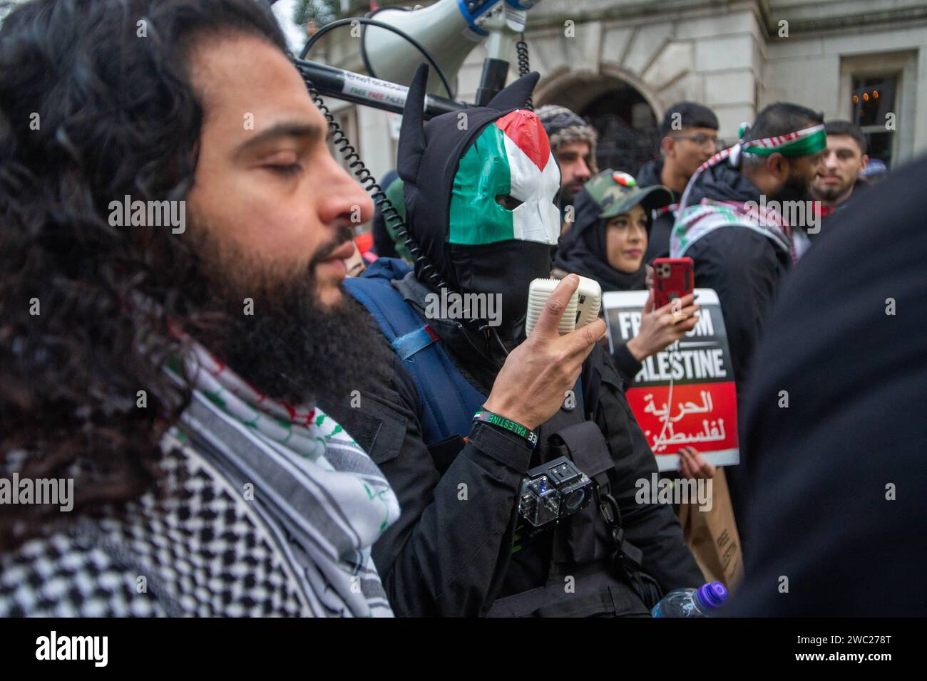 London UK 13th January 2024 No Face Bullhorn Speaks To The Police   London Uk 13th January 2024 No Face Bullhorn Speaks To The Policepro Palestine Demonstration Criticising The Israeli Government And World Leaders And Calling For A Ceasefire Rallies In Parliament Square With The Tailback Going Beyond Embankment Tube Manolo The Pomeranian Wears His Palestinian Colours With Pride Credit Peter Hoganalamy 2WC278T 